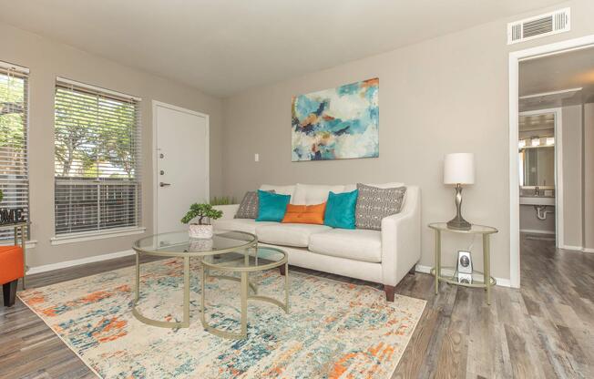 a living room filled with furniture and a large window