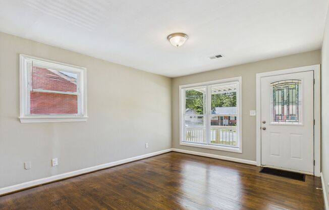 Updated home with New Kitchen, Hardwood Floors, Fenced!