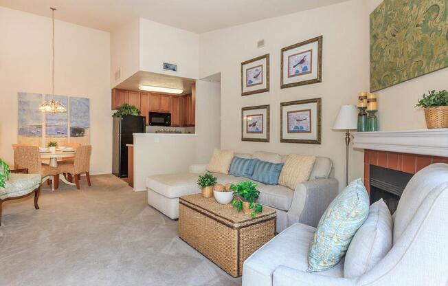 a living room filled with furniture and a fireplace