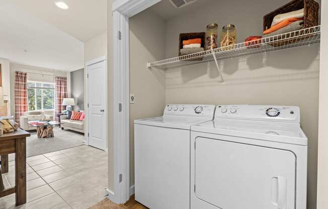 the washer and dryer in the laundry room of a house