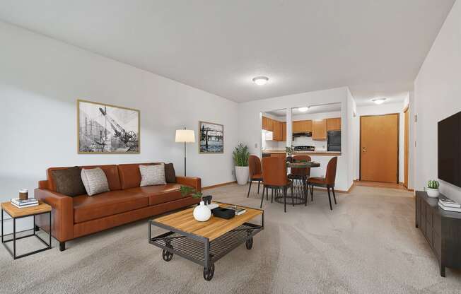 the living room of an apartment with a couch and a coffee table