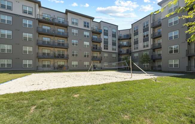 a volleyball court at the flats at big tex apartments in san antonio, tx