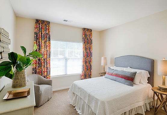 Bedroom with window; carpet