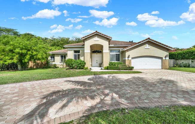 Elegant 4-Bedroom Pool Home in Exclusive Gated Community