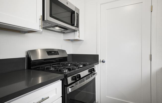 Kitchen with Stainless Steel Appliances in Sherman Oak Apartment