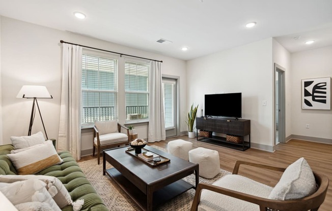 a living room with a couch and a tv