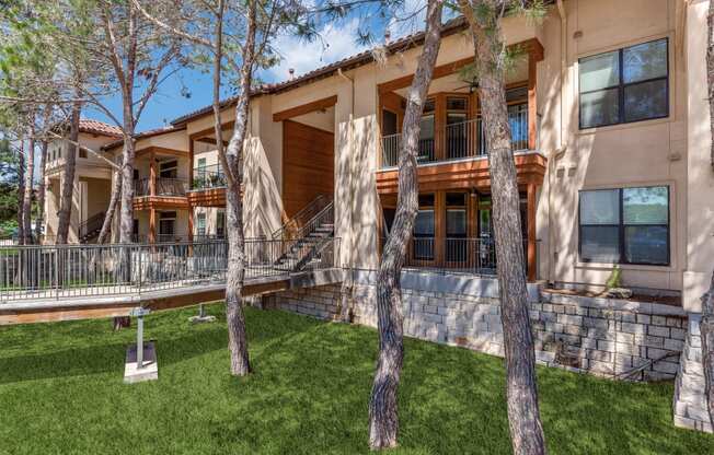 a large house with trees in front of it