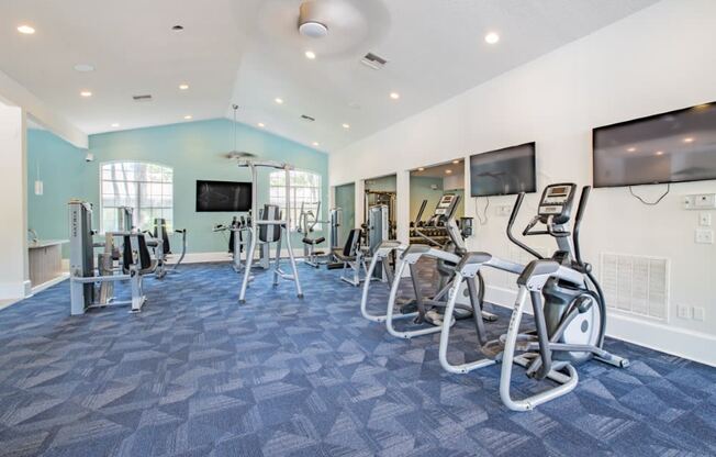 Fitness center with cardio equipment at Creekfront at Deerwood, Jacksonville, FL