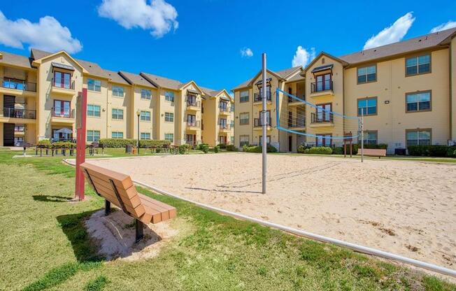 Exterior photo of Oak hollow with benches and beach volleyball