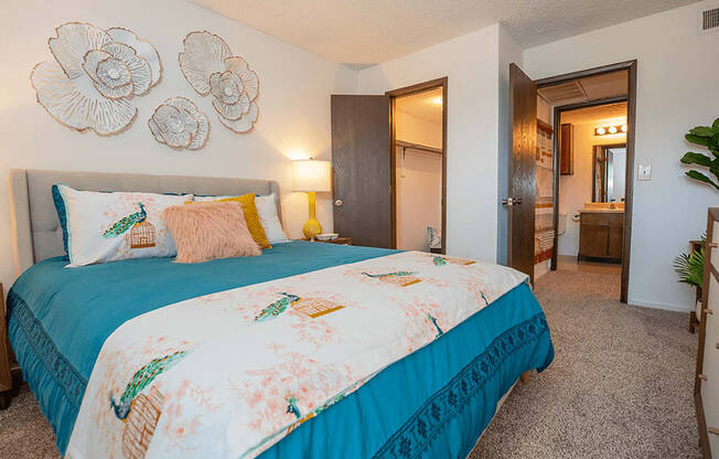 a large bedroom with walk-in closet and bathroom connected