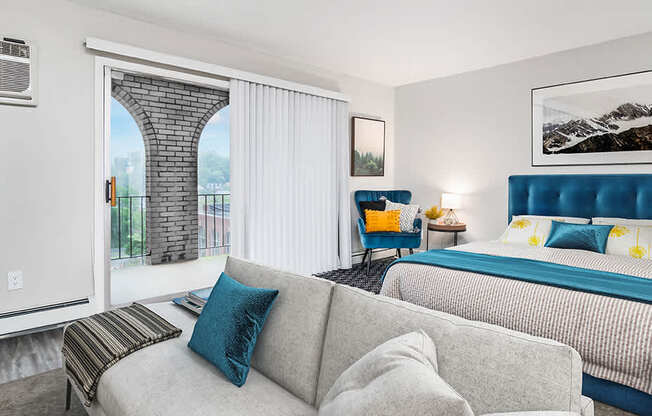a living room with a couch and a bed at The Heights Apartments, Cincinnati, OH, 45220