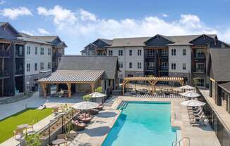 A large building with a pool in front.