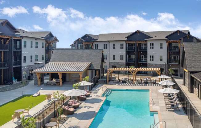 A large building with a pool in front.