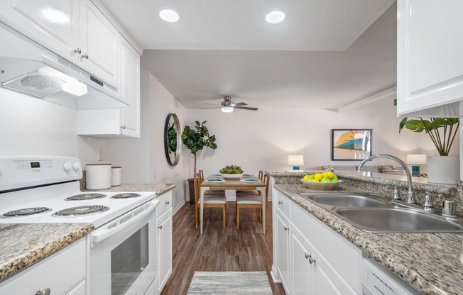 a kitchen and dining area in a 555 waverly unit