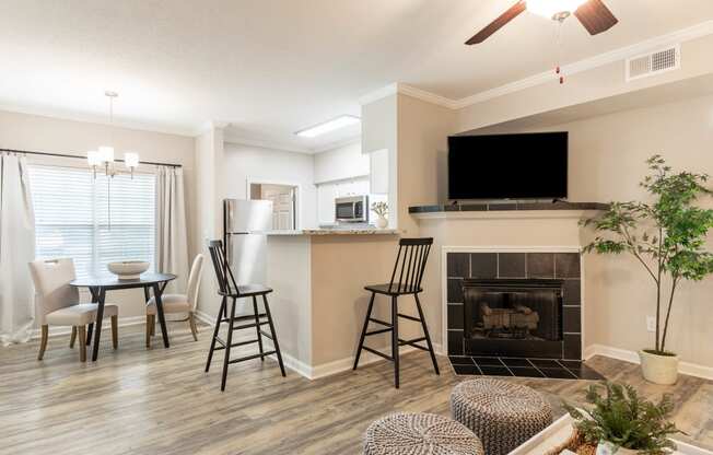 the preserve at ballantyne commons living room and dining room with fireplace