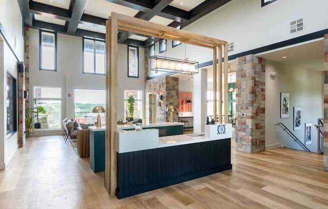 A reception area with a wooden counter and a staircase.