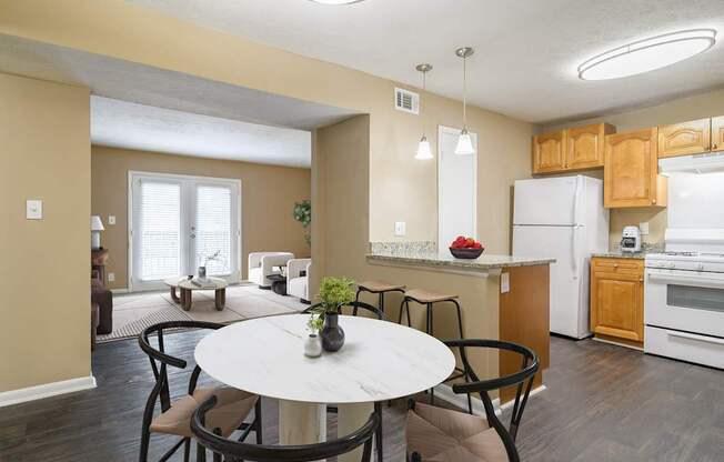 Dining room at Stratford Ridge Apartments near Smyrna, GA, featuring ample space for meals and gatherings with natural lighting and modern fixtures.