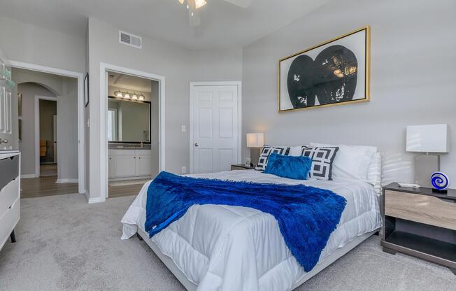 a bedroom with a bed in a room