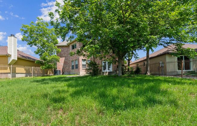 Spacious 4-Bedroom Home with Open Floor Plan & Brick Fireplace