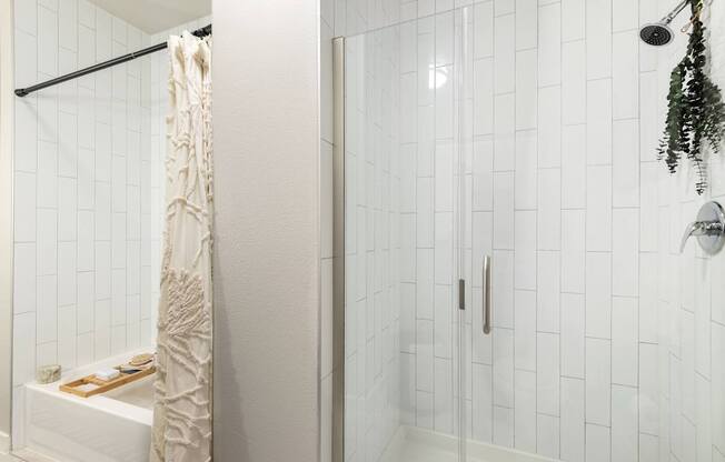 Glass-Enclosed Shower with Vertical Subway Tile Design