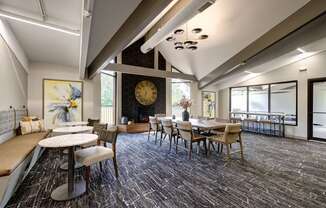 seating and dining areas in the clubhouse at The Bennington Apartments