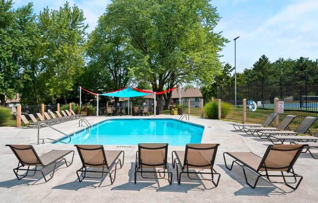 Pool & Sundeck With Lounge Chairs