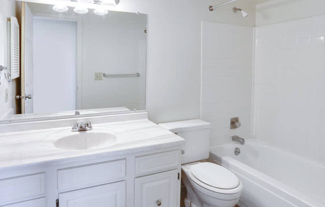 a bathroom with a sink toilet and a tub