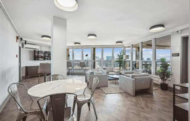 a living room with couches and chairs and a table