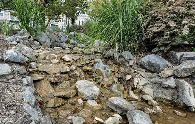 A small waterfall in a rock garden.
