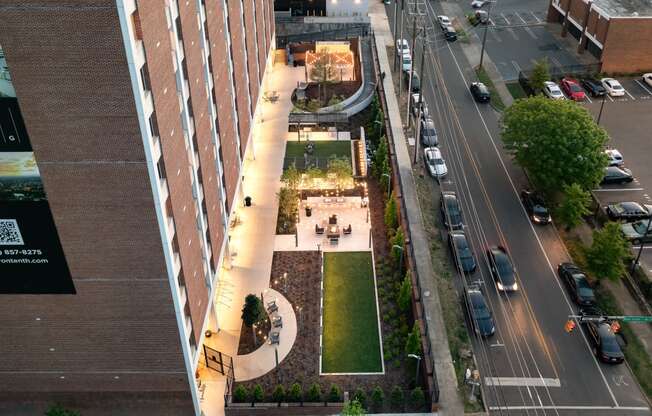 an overhead view of a city street with cars parked on the side of the road and a