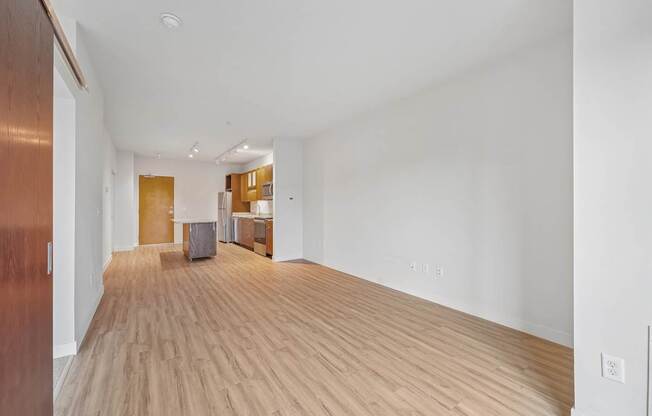 A room with wooden floors and white walls.