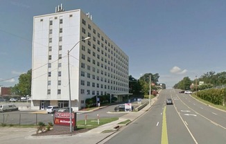 a large white building on the side of a road