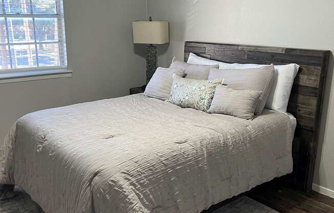 Bedroom with Cozy bed at Tuscany Apartments, Texas