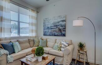 Living Room With Expansive Window at Aviator at Brooks Apartments, Clear Property Management, San Antonio, Texas