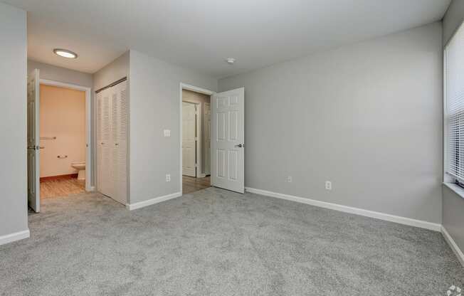 bedroom and a door to a bathroom