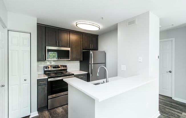 a kitchen with a sink and a refrigerator