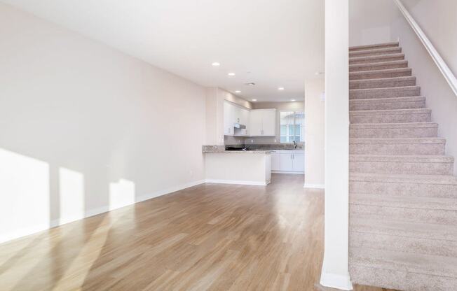 Living room With Staircase at Ocean Air, San Diego, CA