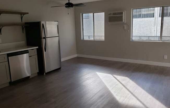 Kitchen Area With AC Unit, Hard-Wood Flooring, Plenty of Natural Light at Wilson Apartments in Glendale, CA