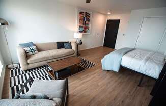 a living room with a couch and a bed at Analog Tacoma, Washington