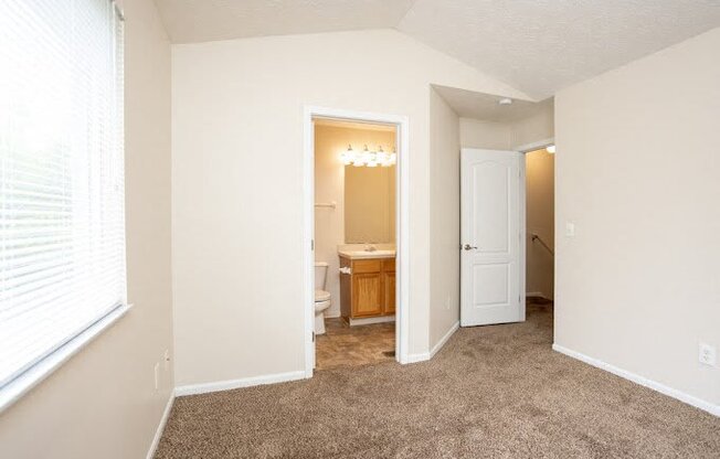 a room with colorful lights on the walls and a door