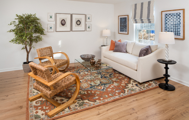 Furnished living room with a sofa, coffee table, and high ceiling at Westridge Gardens