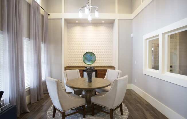 a dining room with a table and chairs