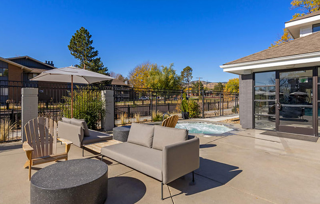 the preserve at ballantyne commons patio with chairs and tables and a pool