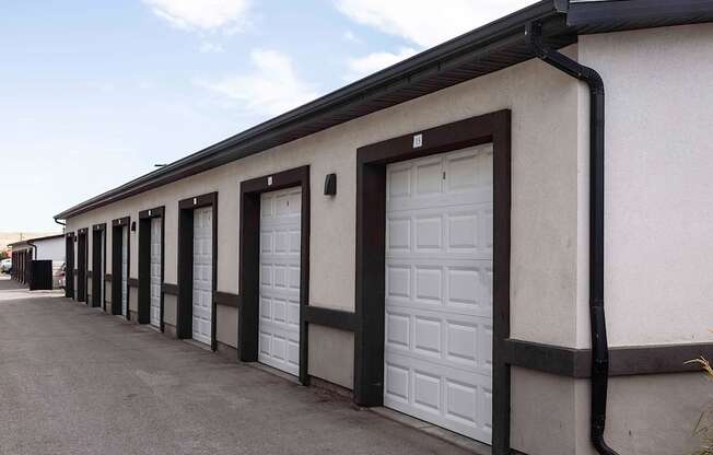 a row of garage doors in front of a building
