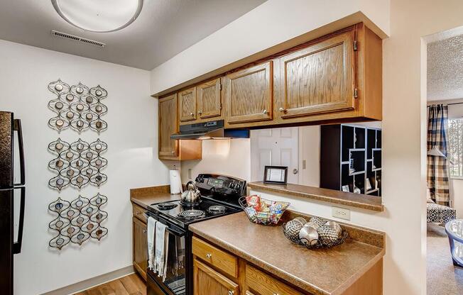 CHARMING KITCHEN WITH BLACK APPLIANCES