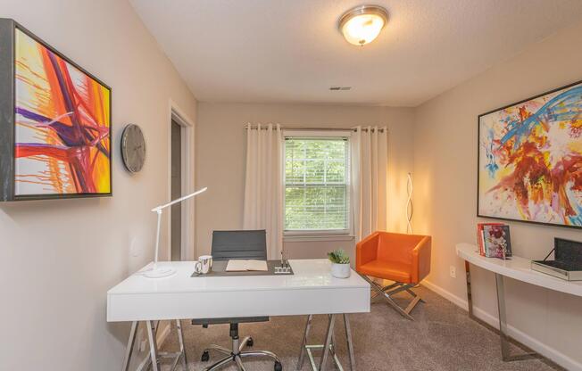 a living room filled with furniture and a flat screen tv