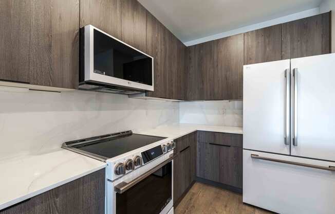 a kitchen with a stove microwave and refrigerator