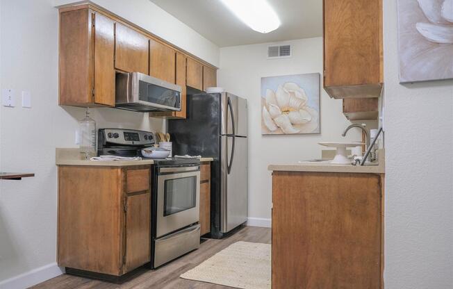 a kitchen with a stove top oven sitting inside of a refrigerator