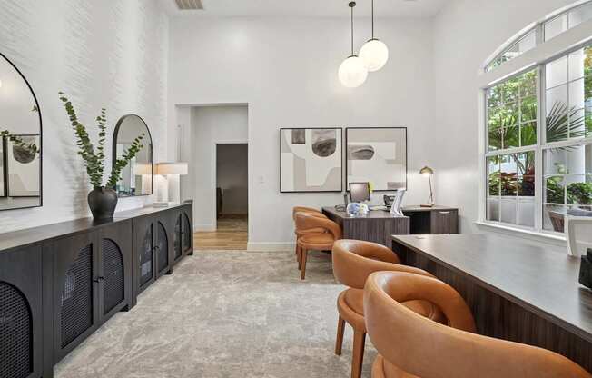 A modern interior with a long wooden table and chairs.