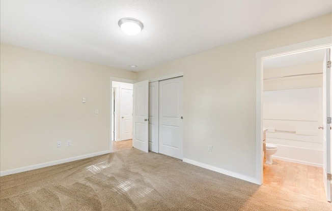 Cascade Woods bedroom with sliding closet door
